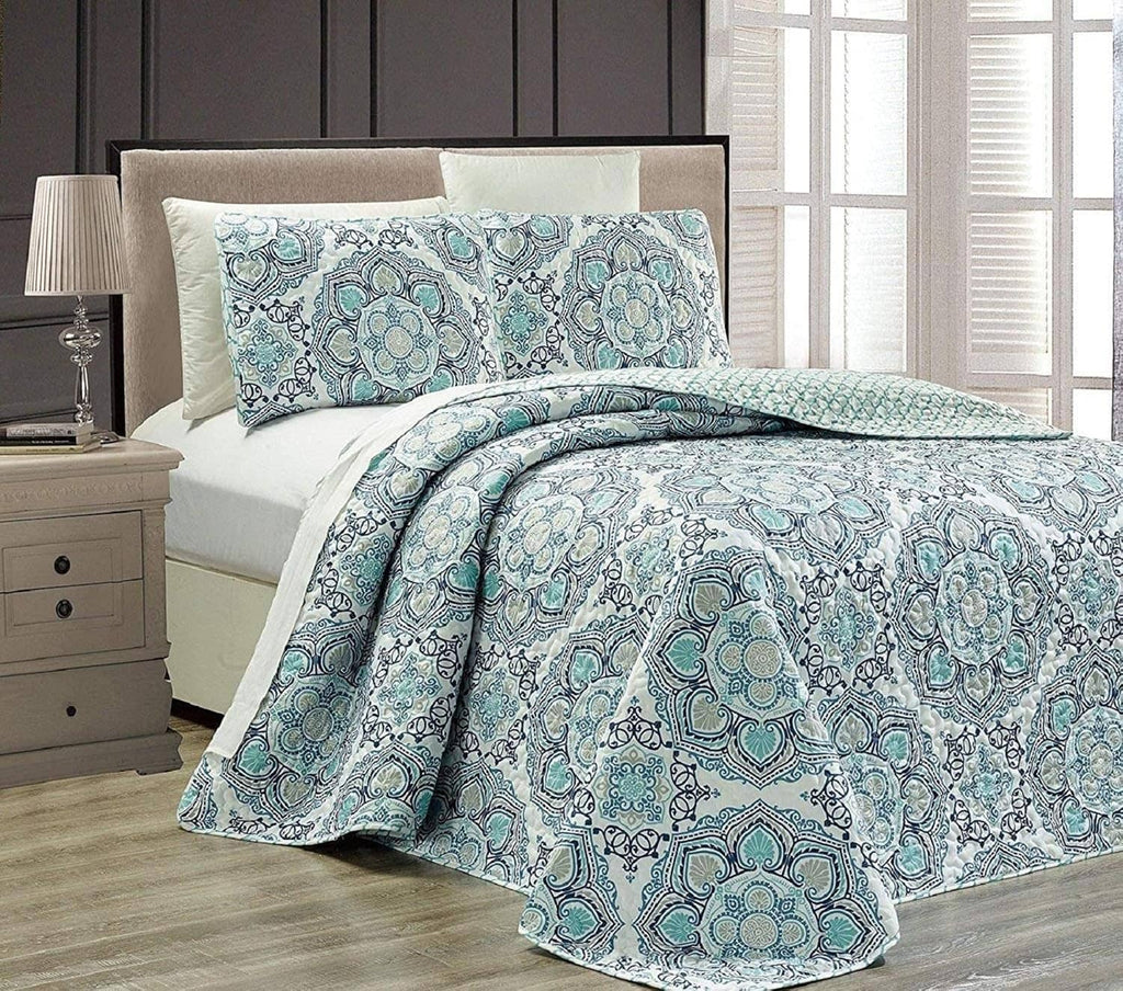 Reversible bedspread set in blue and teal medallion pattern with folded corner drape