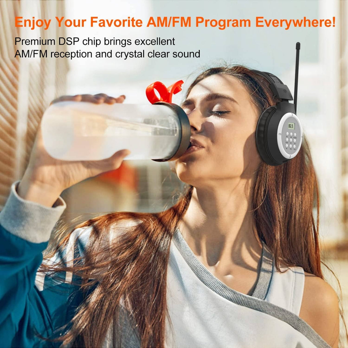 Black AM/FM radio headphones worn over ears with extended antenna