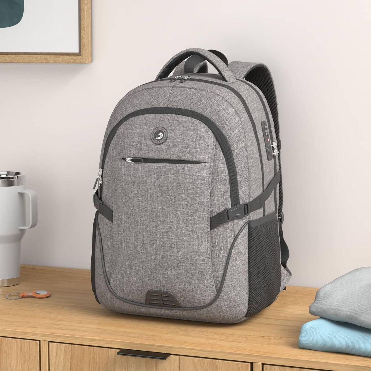 Gray laptop backpack with front organizer pocket and adjustable shoulder straps, front view.