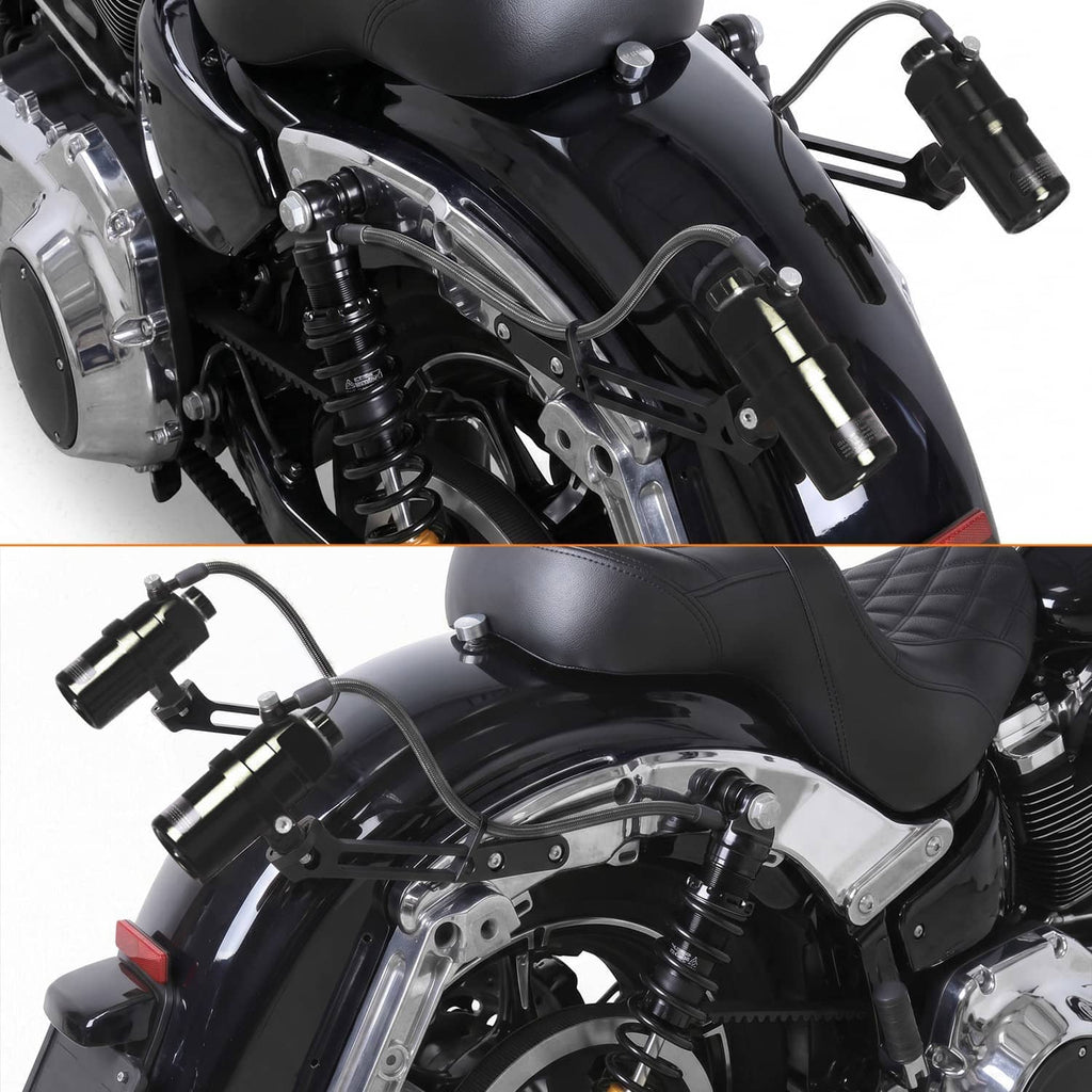 Motorcycle rear suspension shocks mounted under the seat with black reservoir bottles
