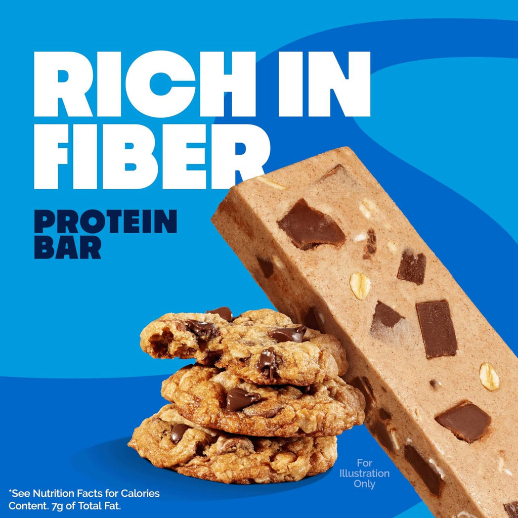 Oatmeal chocolate chip protein bar on wrapper with stacked oats and chocolate pieces