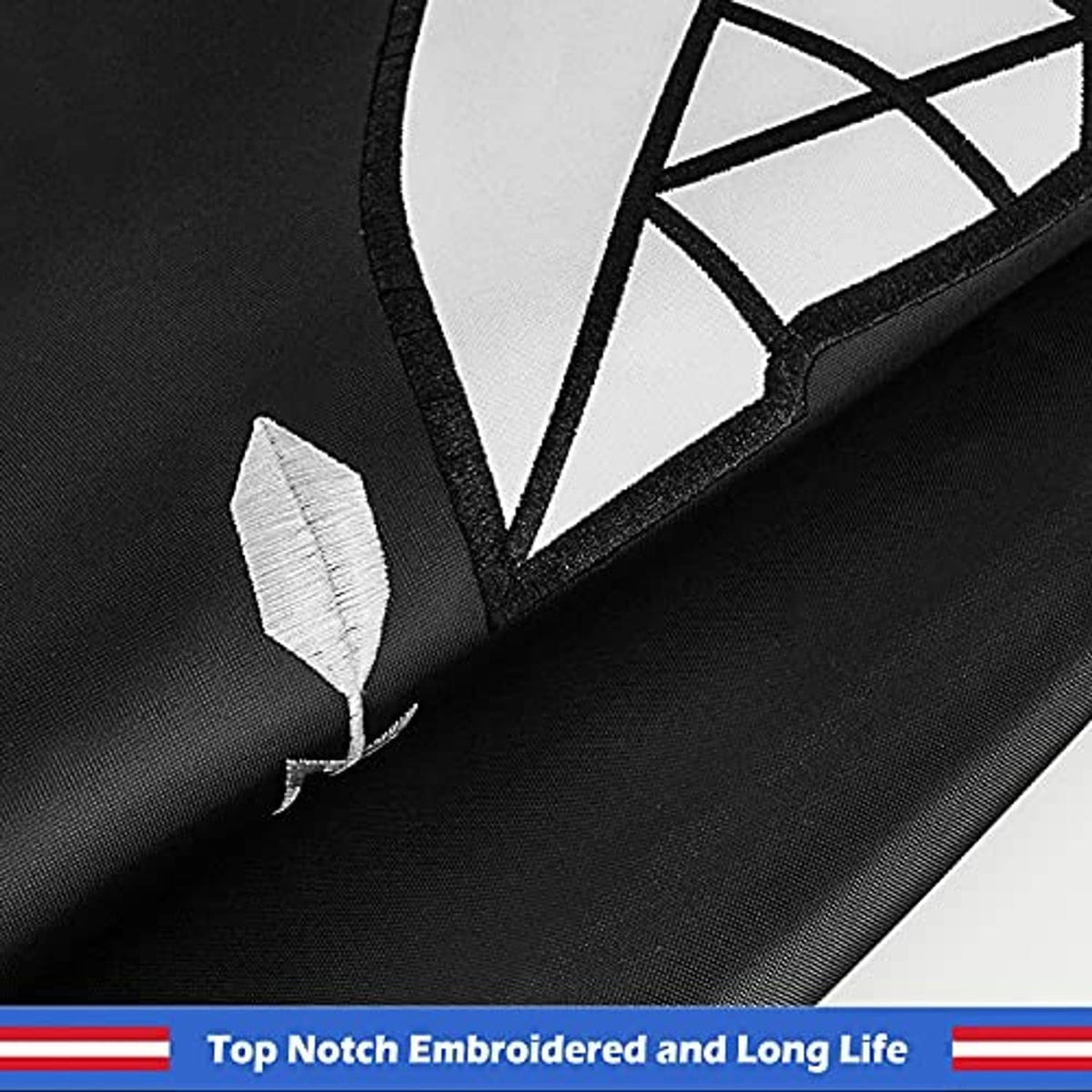 Embroidered POW-MIA flag corner detail with black trim and visible stitched seam