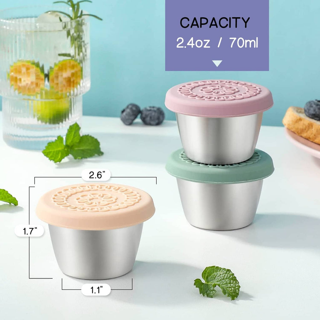 Small 2.4 oz salad dressing container with silicone lid, pink top and mint base