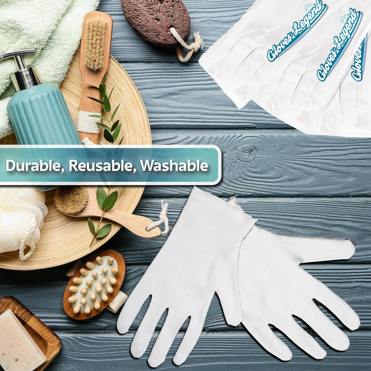 White cotton moisturizing gloves laid flat on a blue surface, full hand coverage