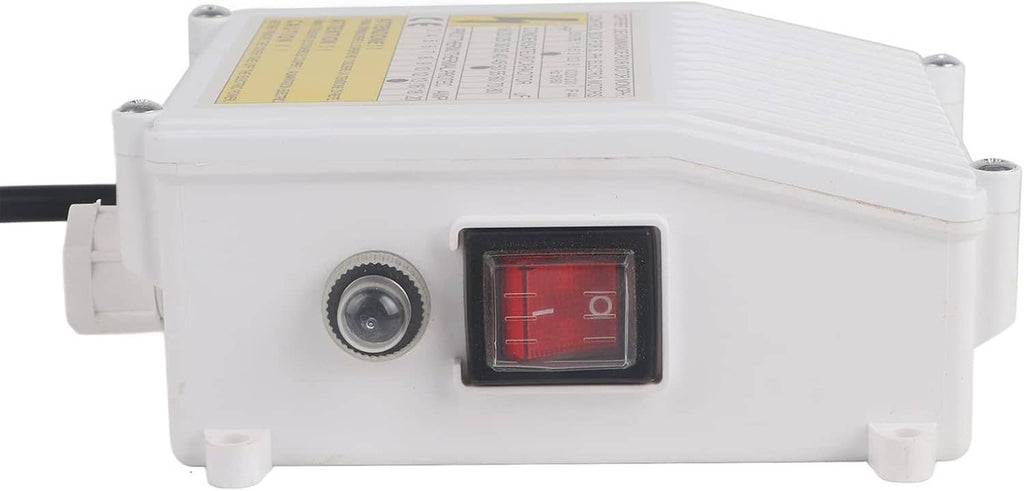 Side view of white submersible pump controller with red rocker switch and round port.