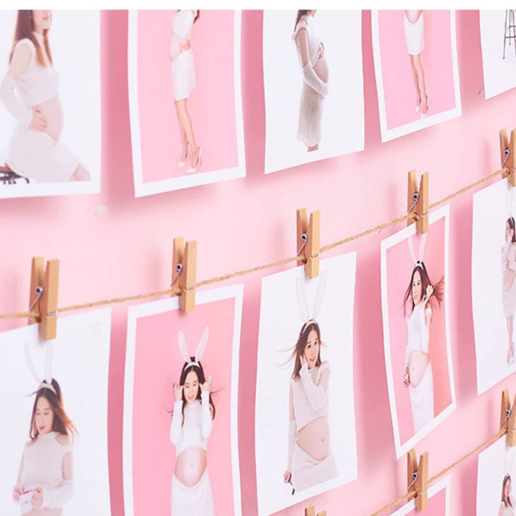 Wooden mini clothespins clipping papers or photos along a line