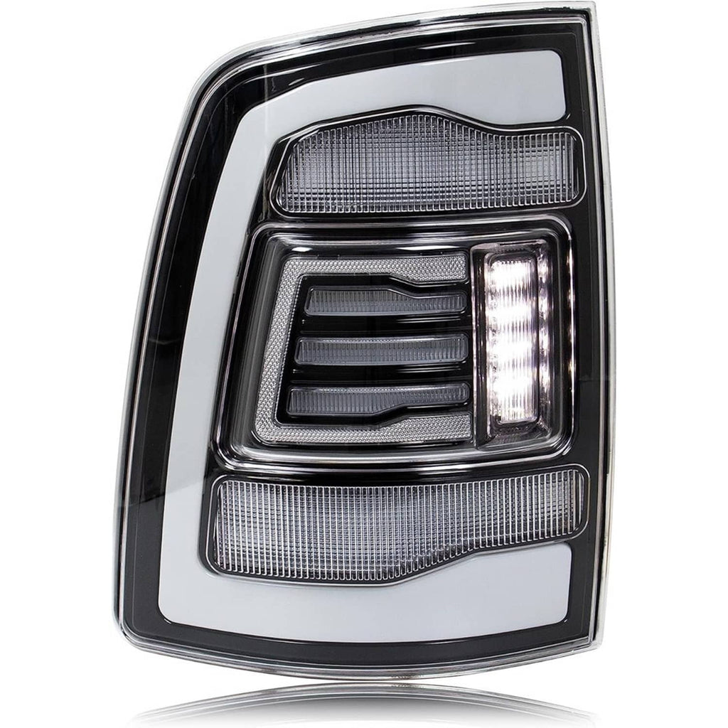 Single LED tail light with white outer panel, gray reflector, and clear reverse lens