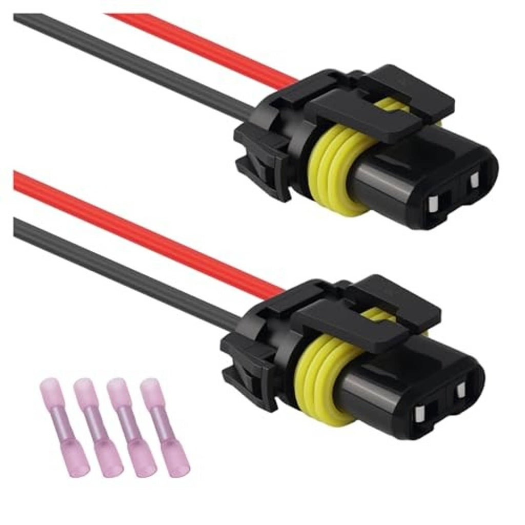 Two wiring harness sockets with yellow insulators, red/black wires and purple pins