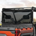 Dark tinted rear windshield panel with black frame for off-road vehicle