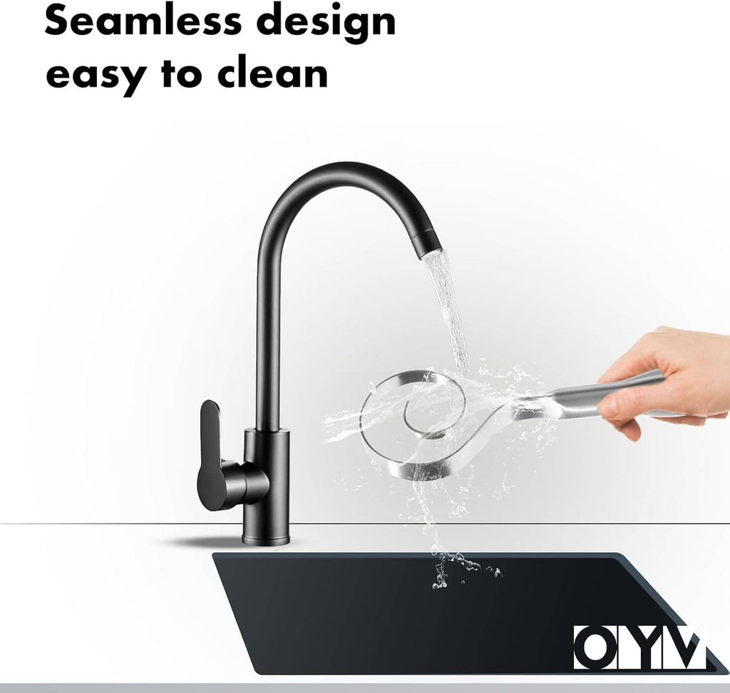 Black sink scene with stainless dough whisk rinsed under running water