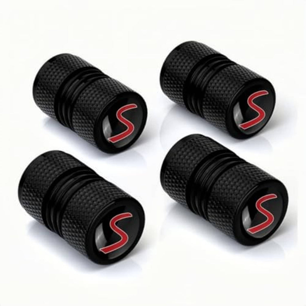 Four black knurled wheel valve caps with red S logo, protective cap style