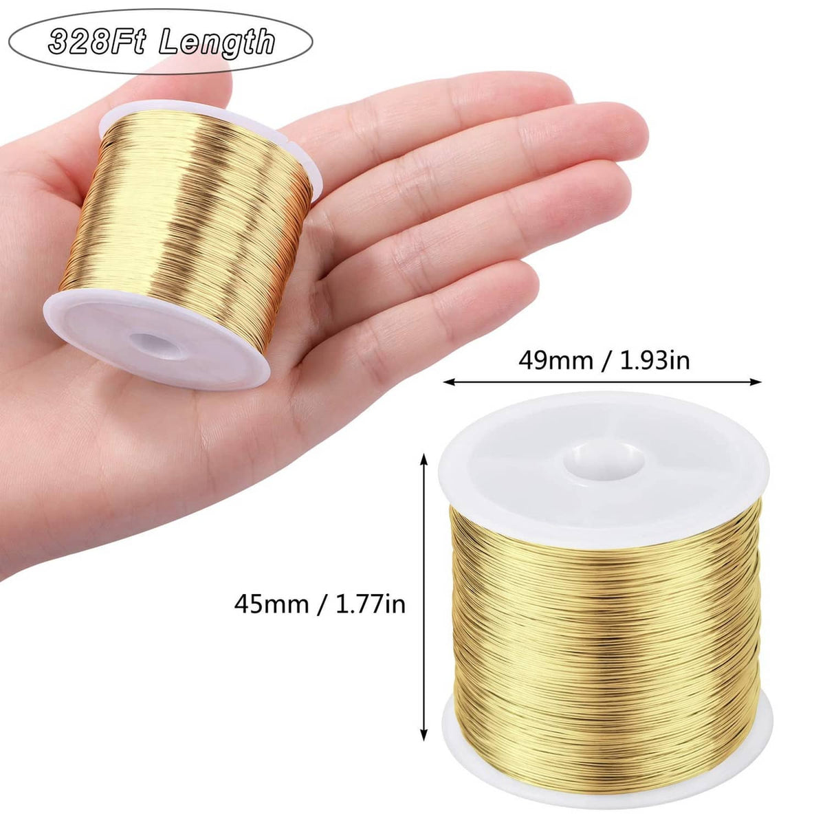 Gold 26-gauge copper jewelry wire coil held in hand beside a white spool
