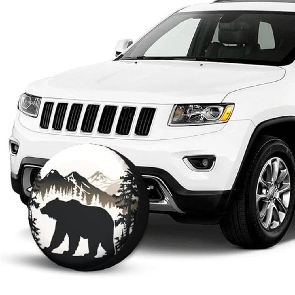 Bear mountain spare tire cover on a white SUV near the front wheel area