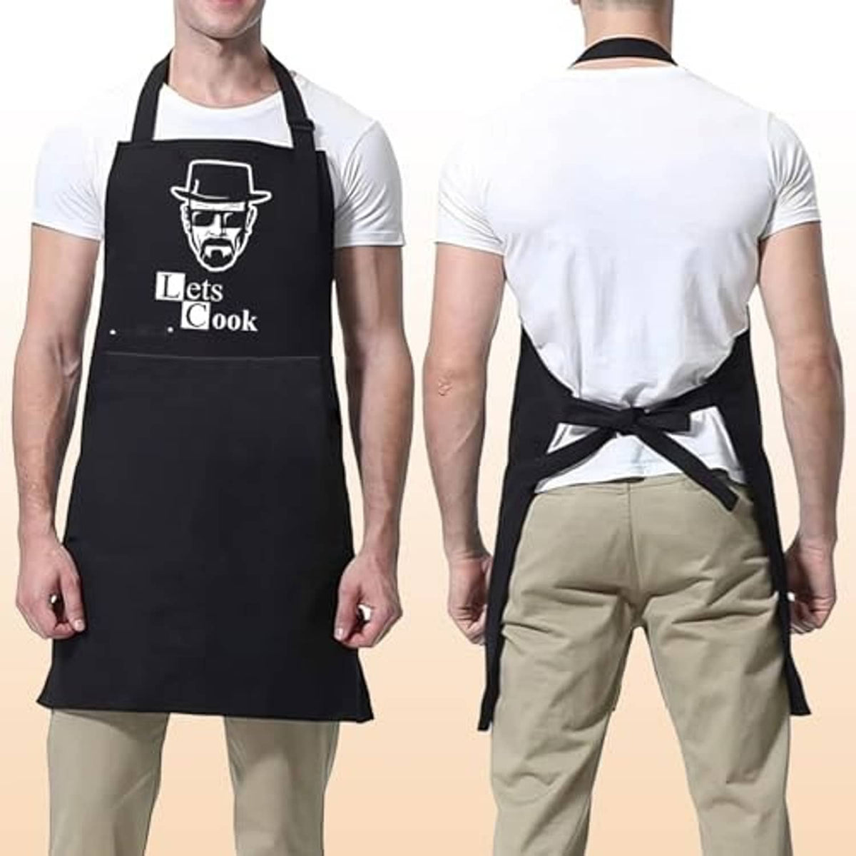 Black apron on man; crisscross back straps and waist tie over a white shirt