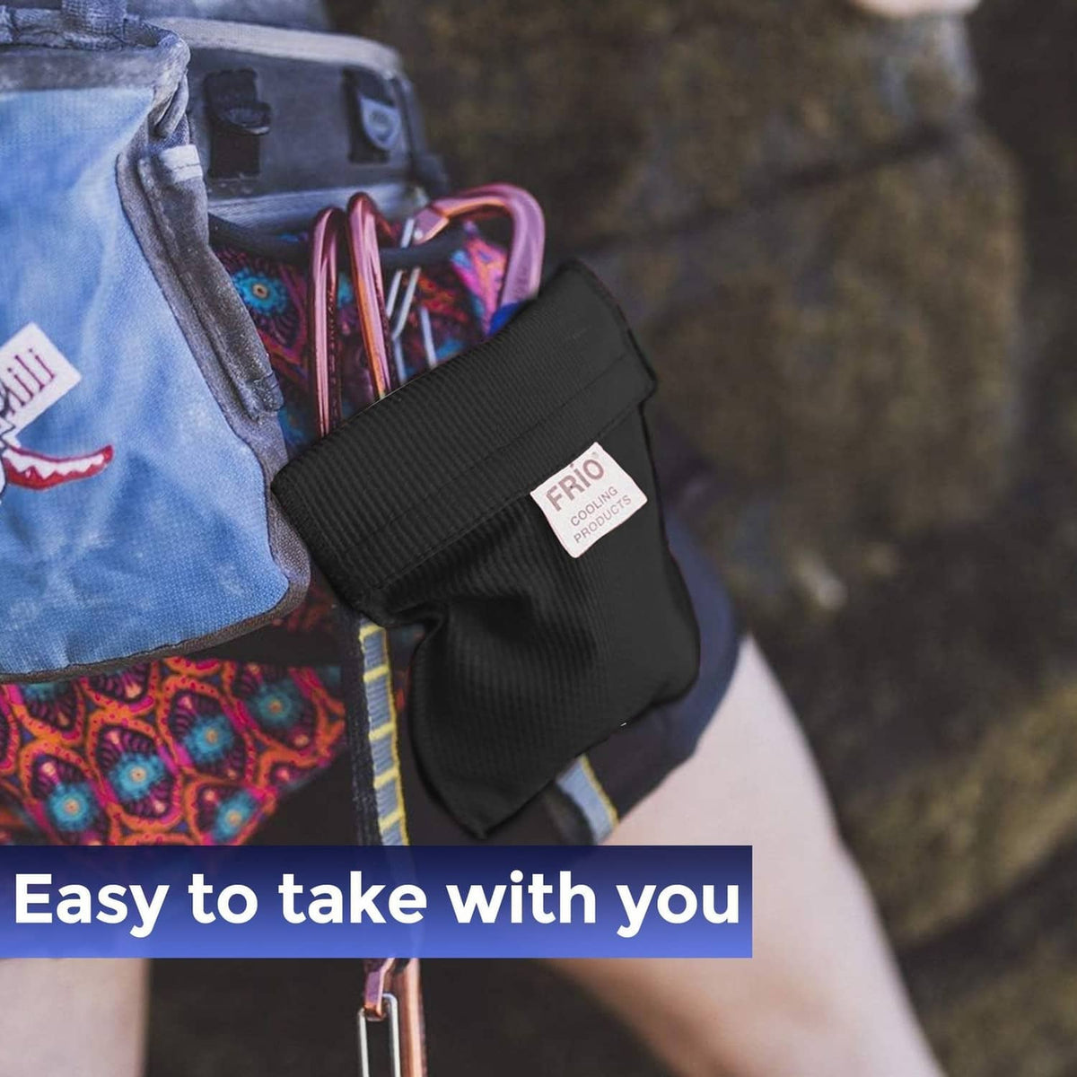 Black FRIO cooling wallet pouch clipped to a bag with pens inside
