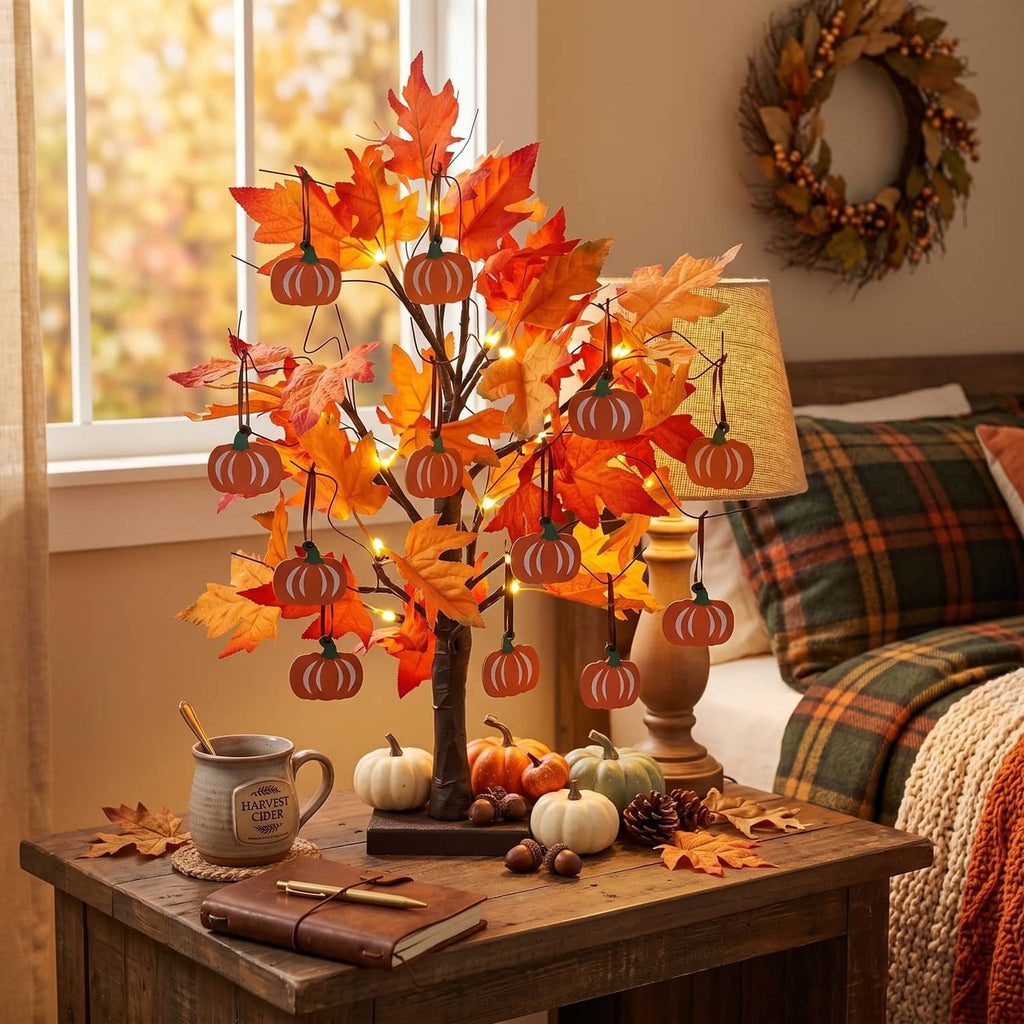 2ft decorative tree with orange maple leaves, warm LED lights, and hanging pumpkin ornaments