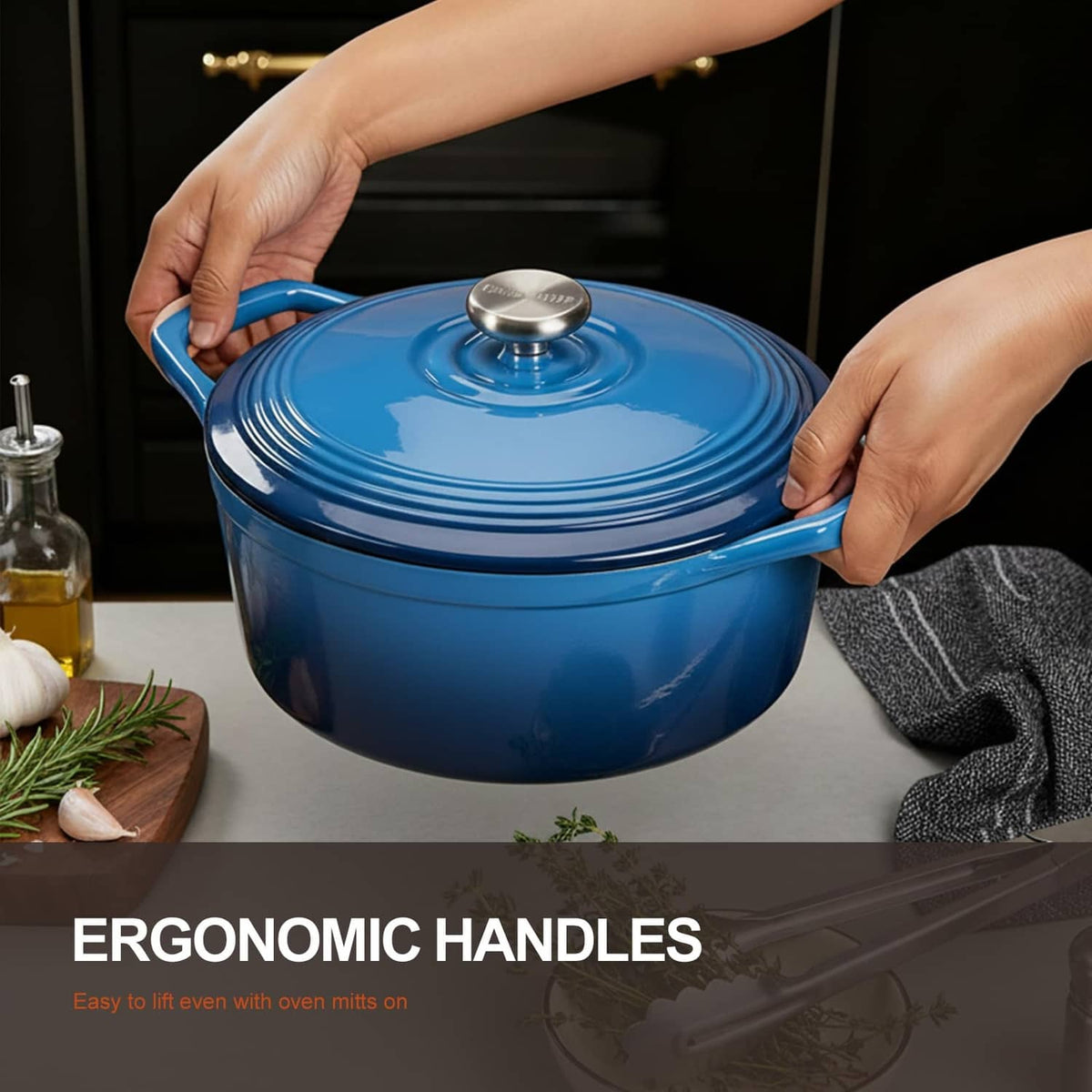 Midnight blue enameled cast iron Dutch oven with knobbed ribbed lid, held by hands