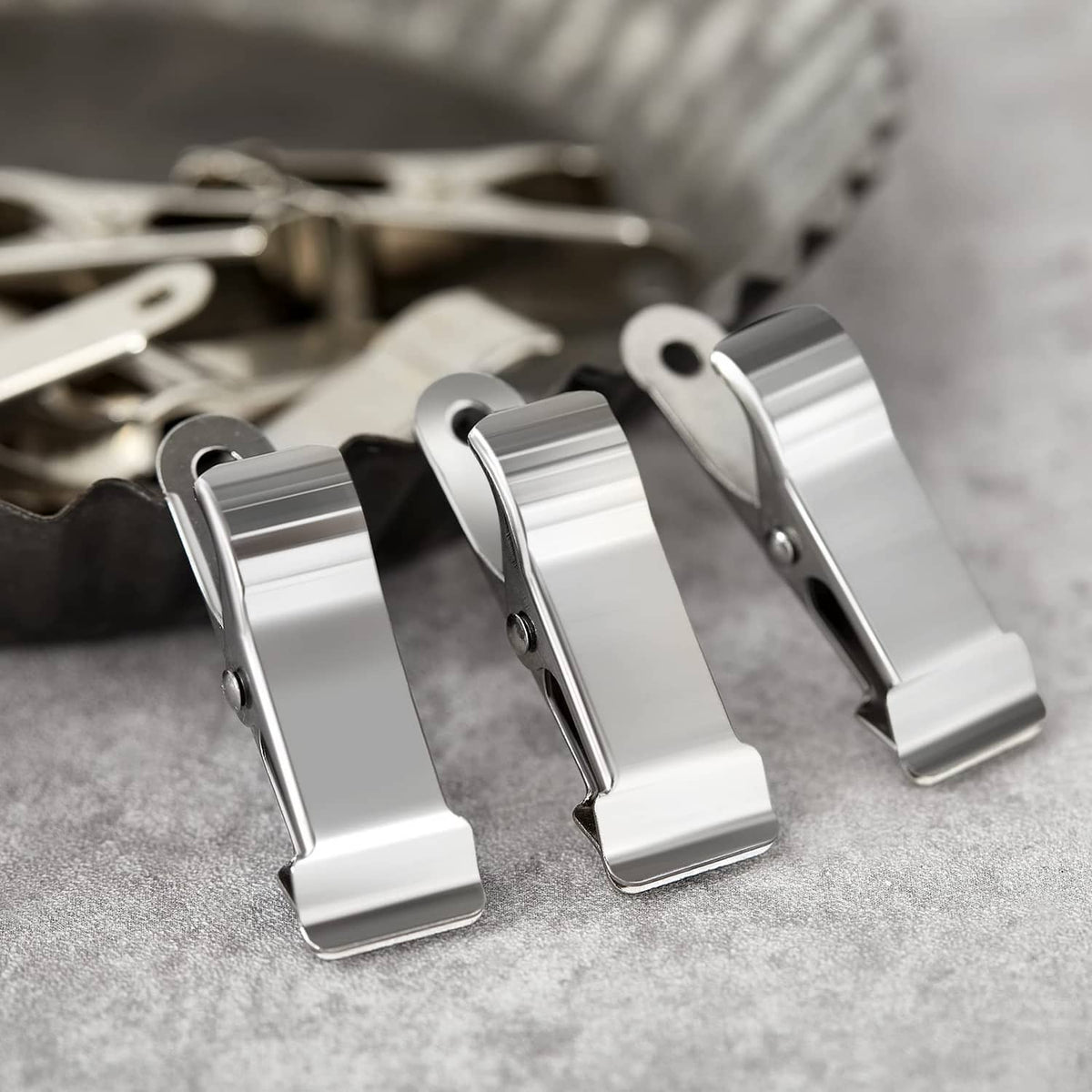Close-up of silver mini crocodile spring clamps with spring hinges and flat mouths