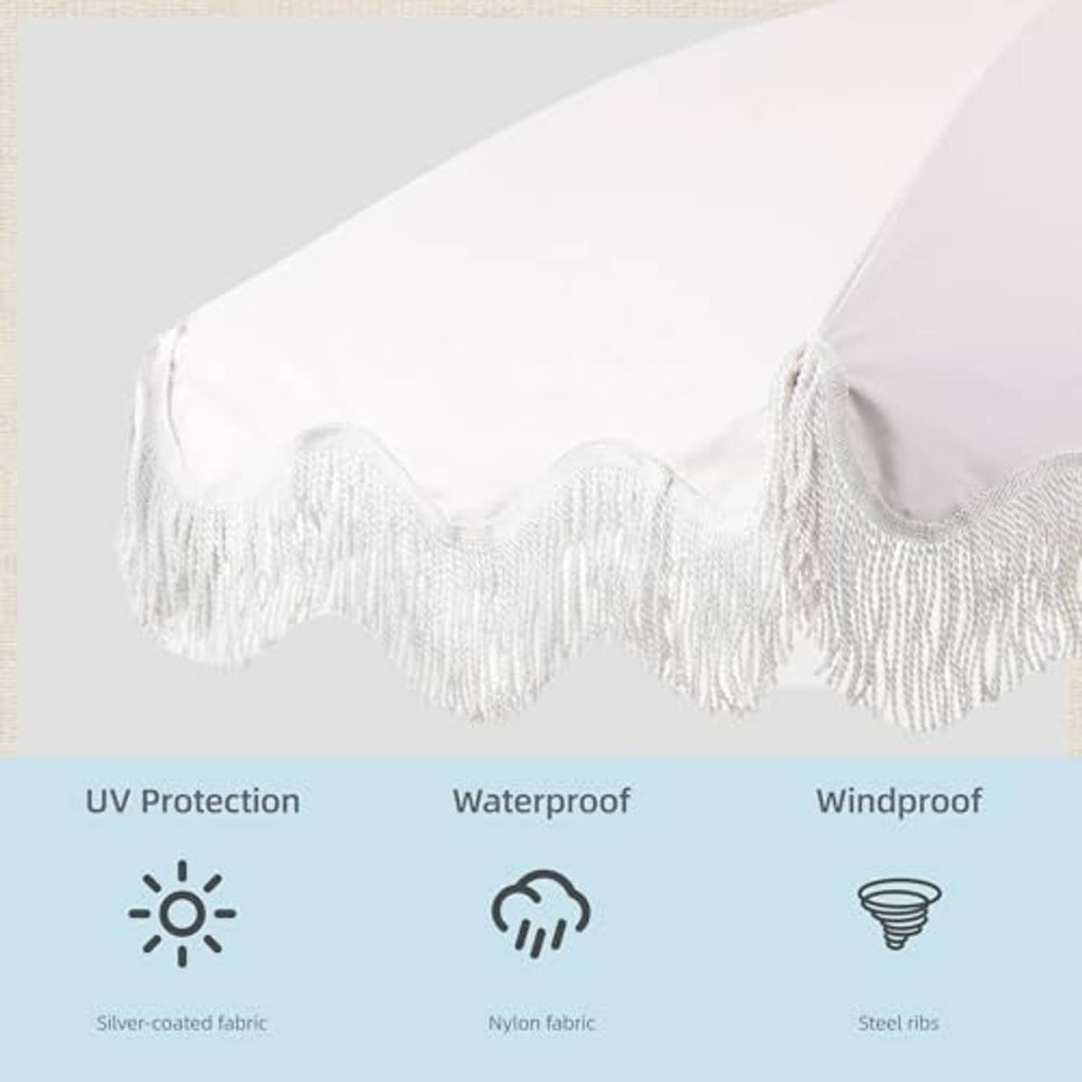 Black-and-white striped umbrella canopy with white tassel fringe trim
