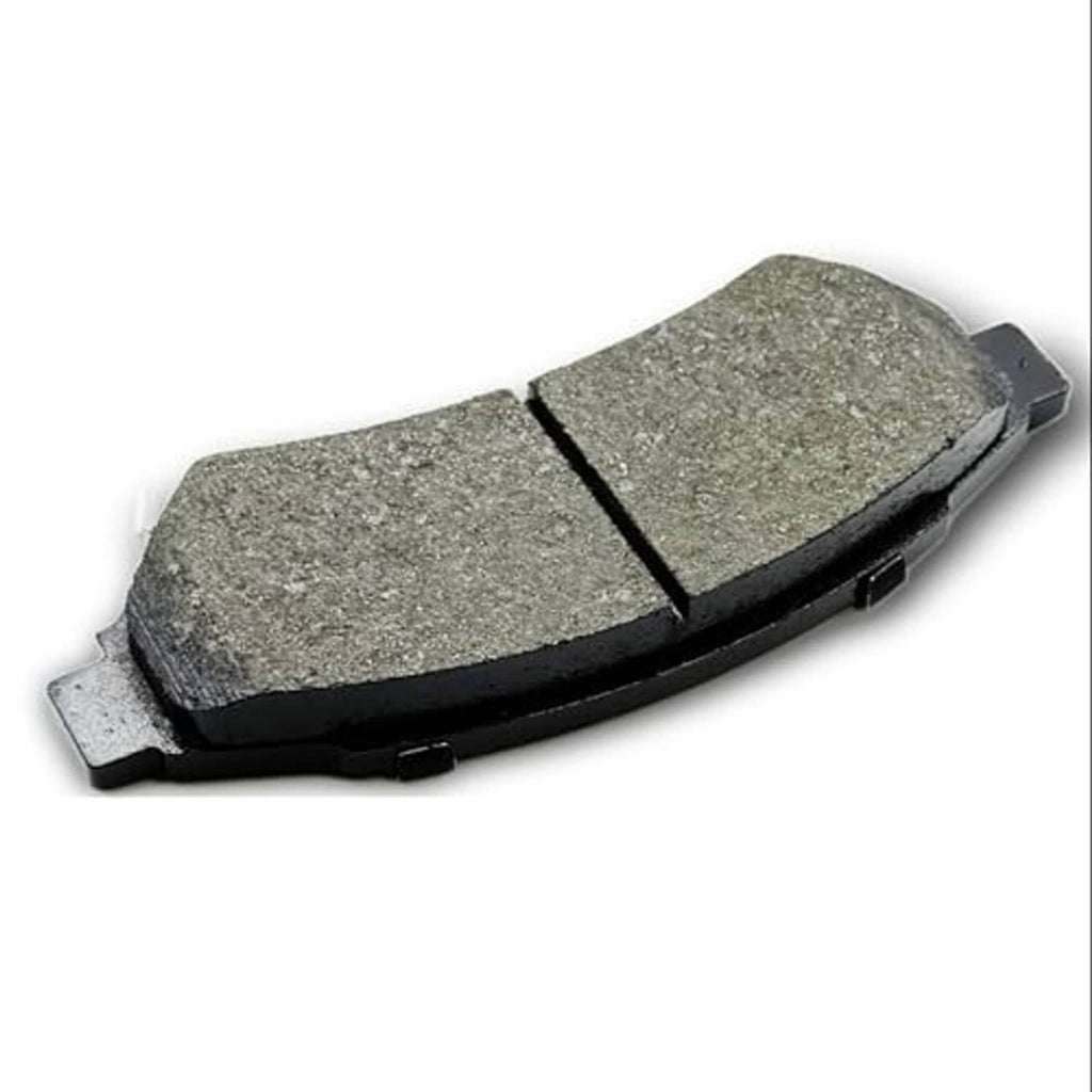 Ceramic brake pad with gray friction surface and black backing, front angle view.