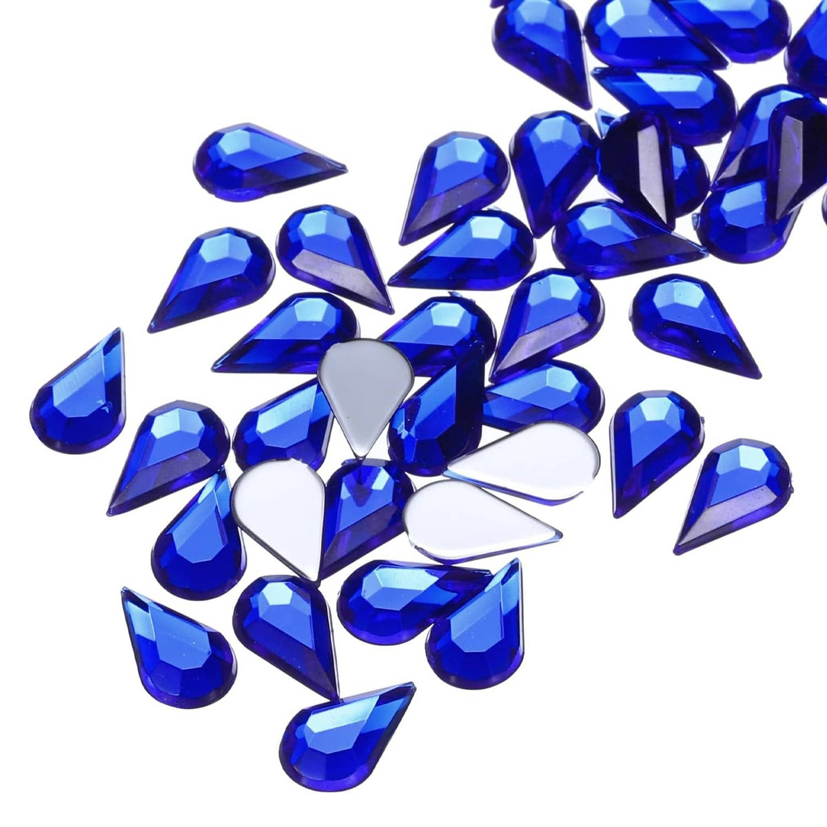 Deep blue acrylic teardrop gems with flat backs, close-up assorted shapes