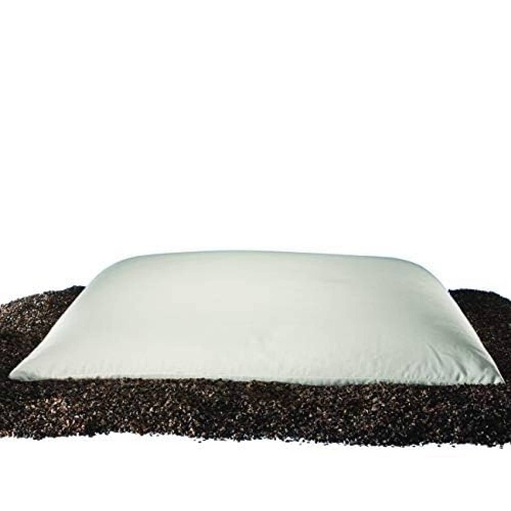 Buckwheat hull pillow with white cover, shown on dark buckwheat fill