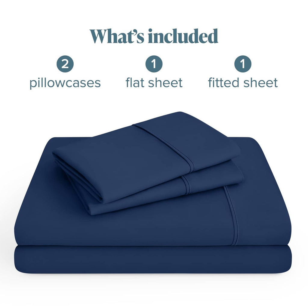 Dark blue microfiber bedding set folded with fitted and flat sheets plus pillowcases