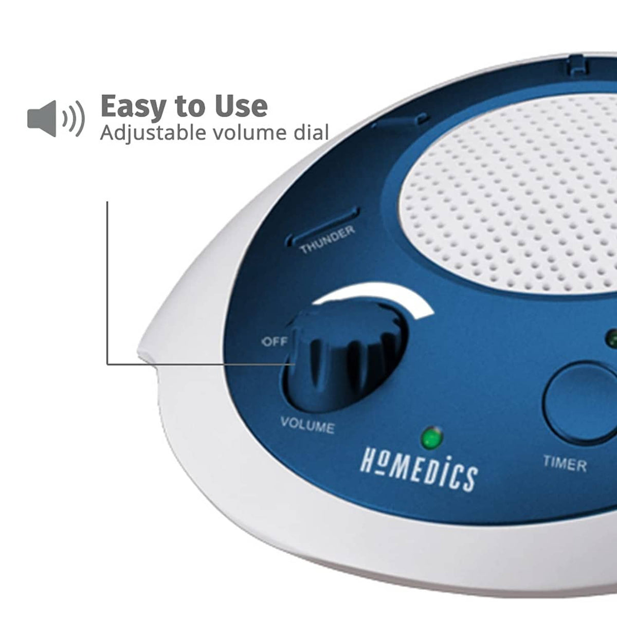 Close-up of blue and white sound machine with adjustable volume dial and buttons