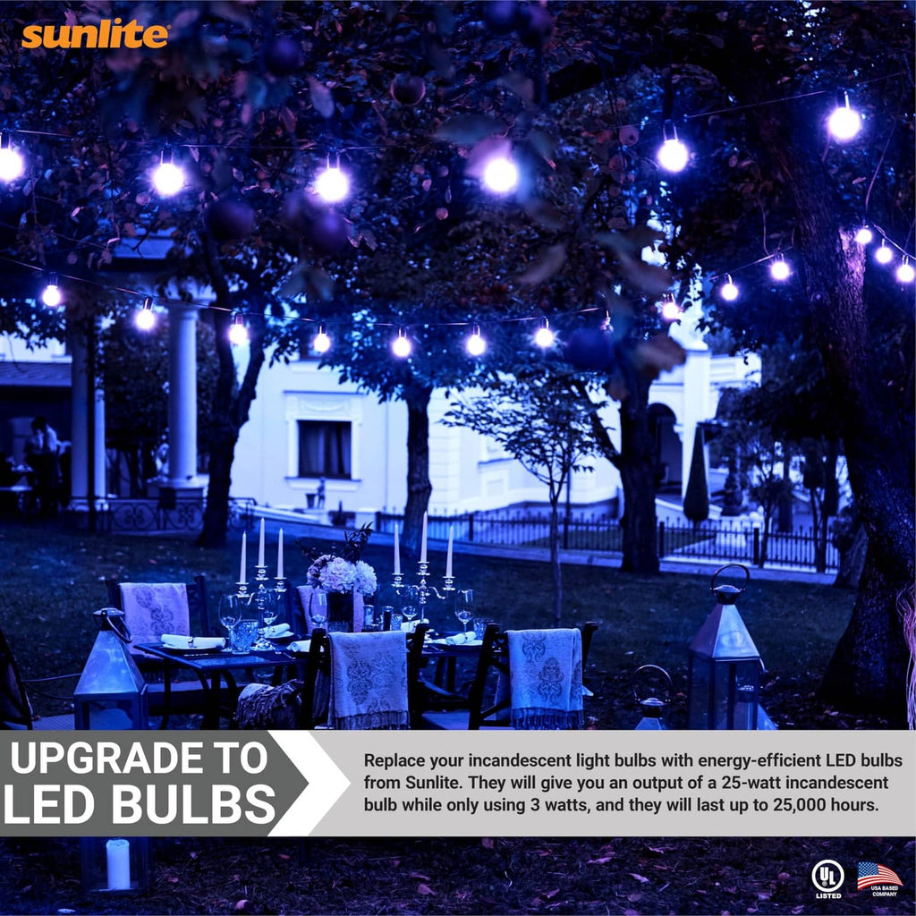 Blue LED bulbs hanging outdoors under string lights