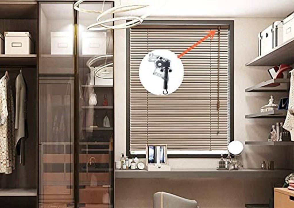 Wand tilter mechanism mounted on horizontal blinds in a room, metal bracket and wand