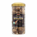 Organic black garlic whole bulbs in clear plastic jar with gold lid