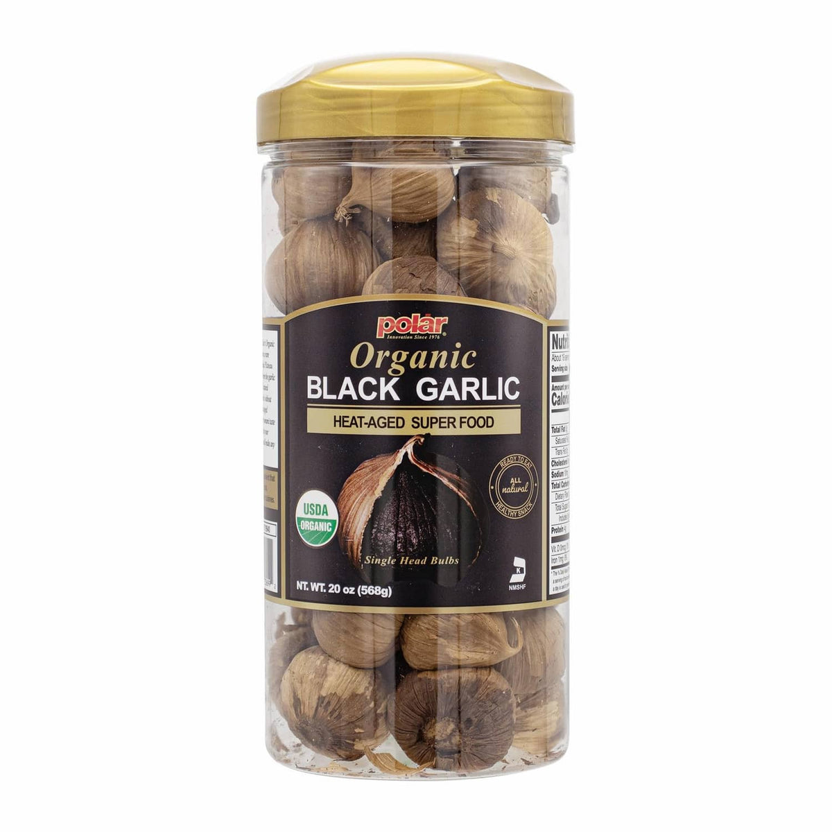 Organic black garlic whole bulbs in clear plastic jar with gold lid