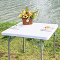Square fitted white table cover on table top, snug elastic stretch fit