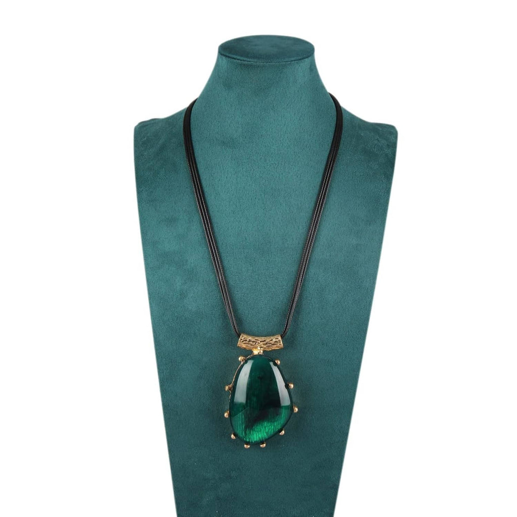 Green teardrop pendant necklace with black faux leather cord and gold textured bail