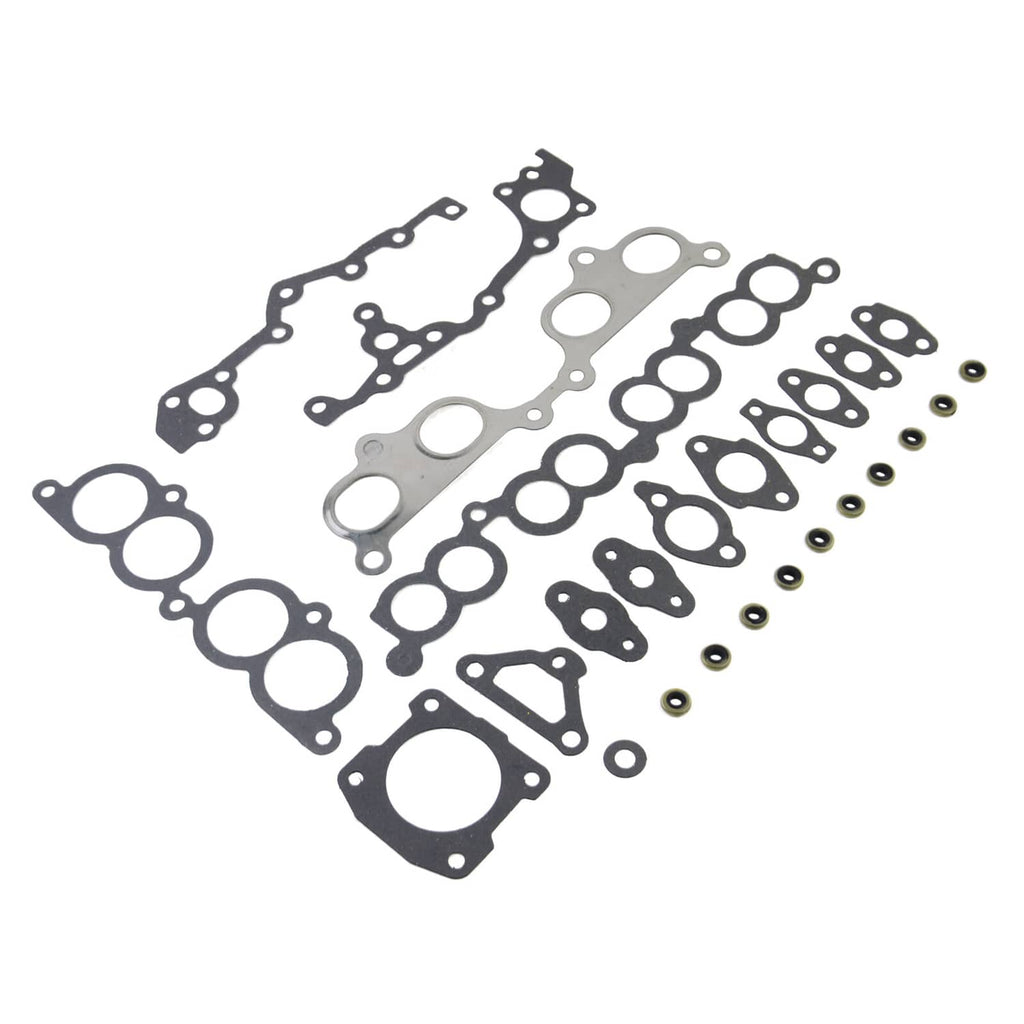 Engine head gasket set with bolts: assorted gasket sheets, formed seals, and small parts.