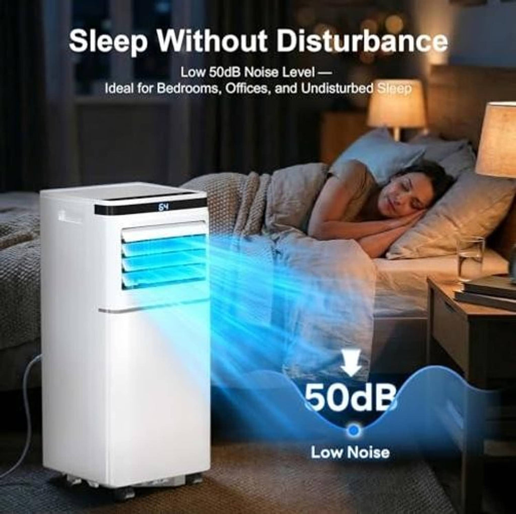 White portable air conditioner in bedroom corner with cool air blowing from front vents.