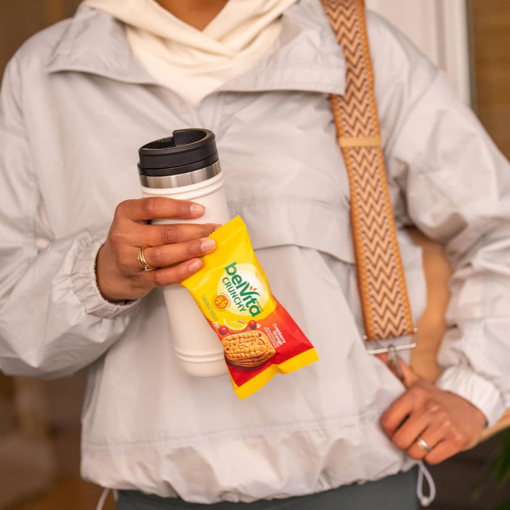 Belvita Crunchy cranberry-orange breakfast biscuits pack held in hand