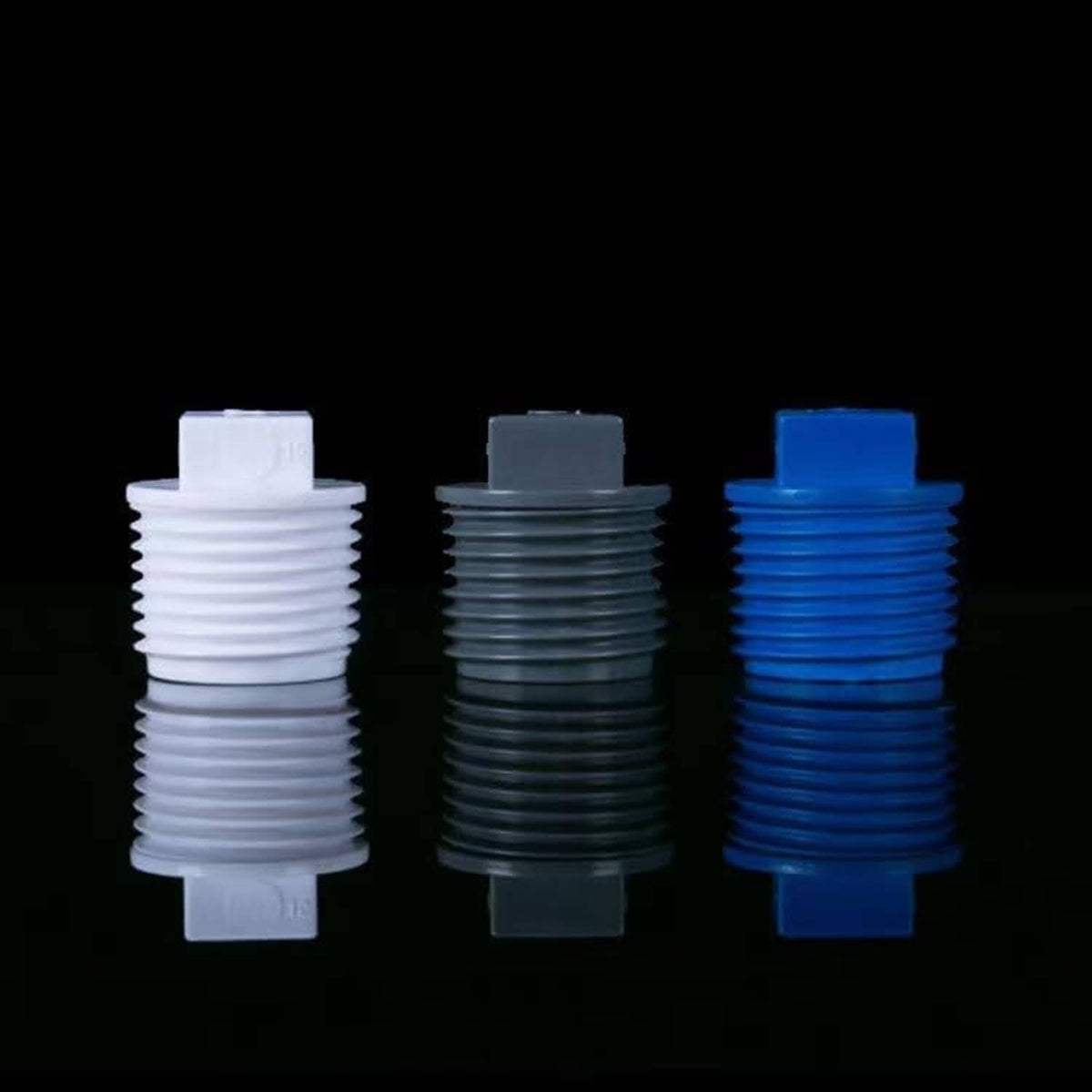 PVC male threaded plug caps: white, gray, and blue shown side-by-side