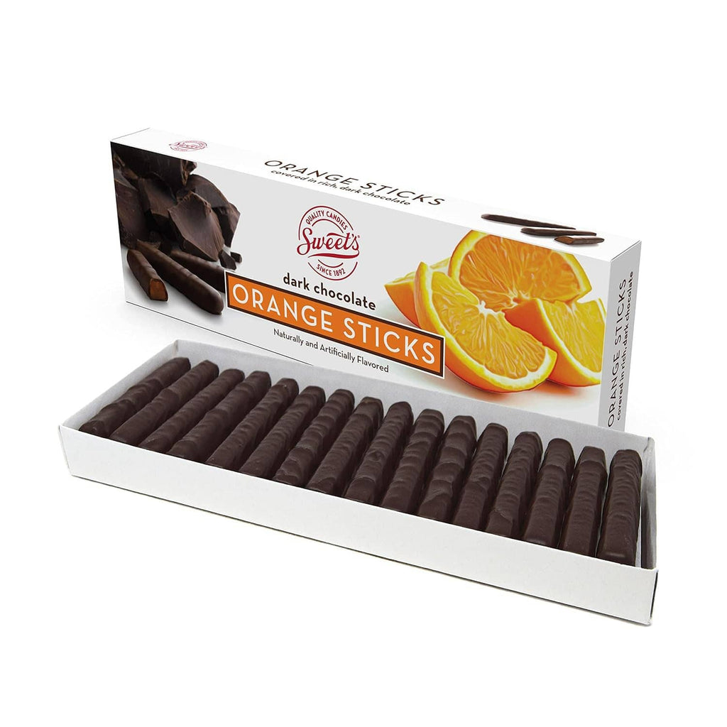 Orange-flavored dark chocolate sticks in open gift box with orange slices graphic