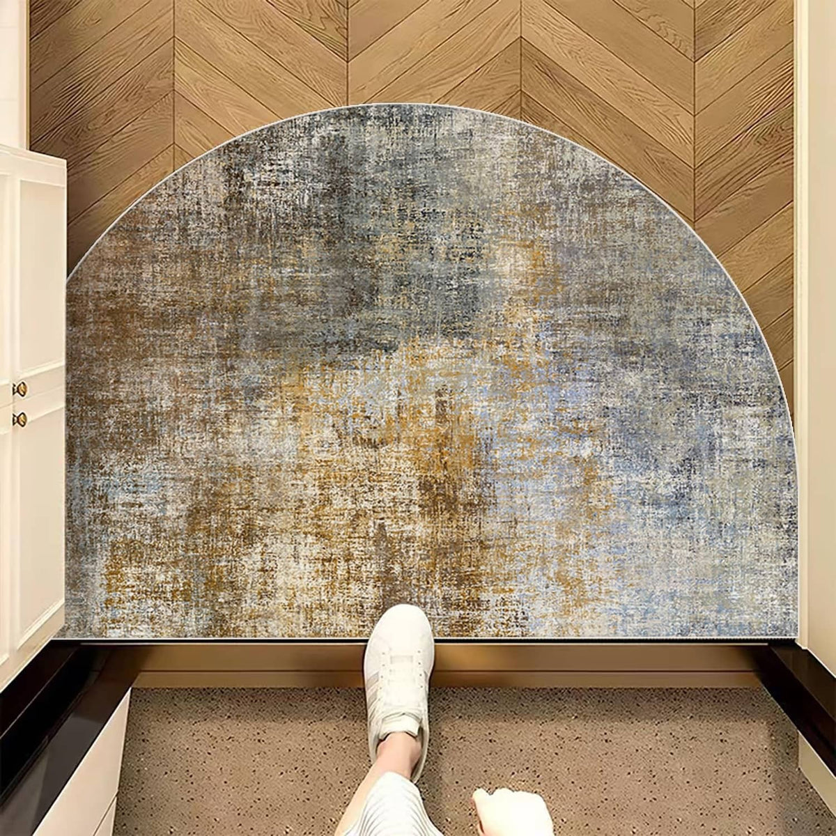 Semicircular textured doormat with blue, gray, and tan mottled pattern