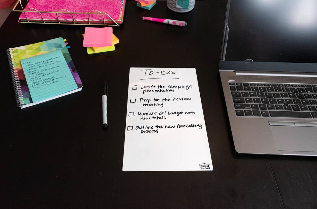 White to-dos dry erase sheet with checkboxes on a desk