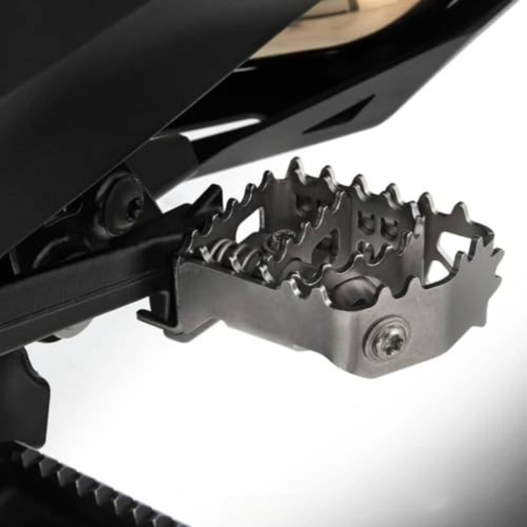 Metal motorcycle footpeg bracket with serrated insert and visible mounting screw