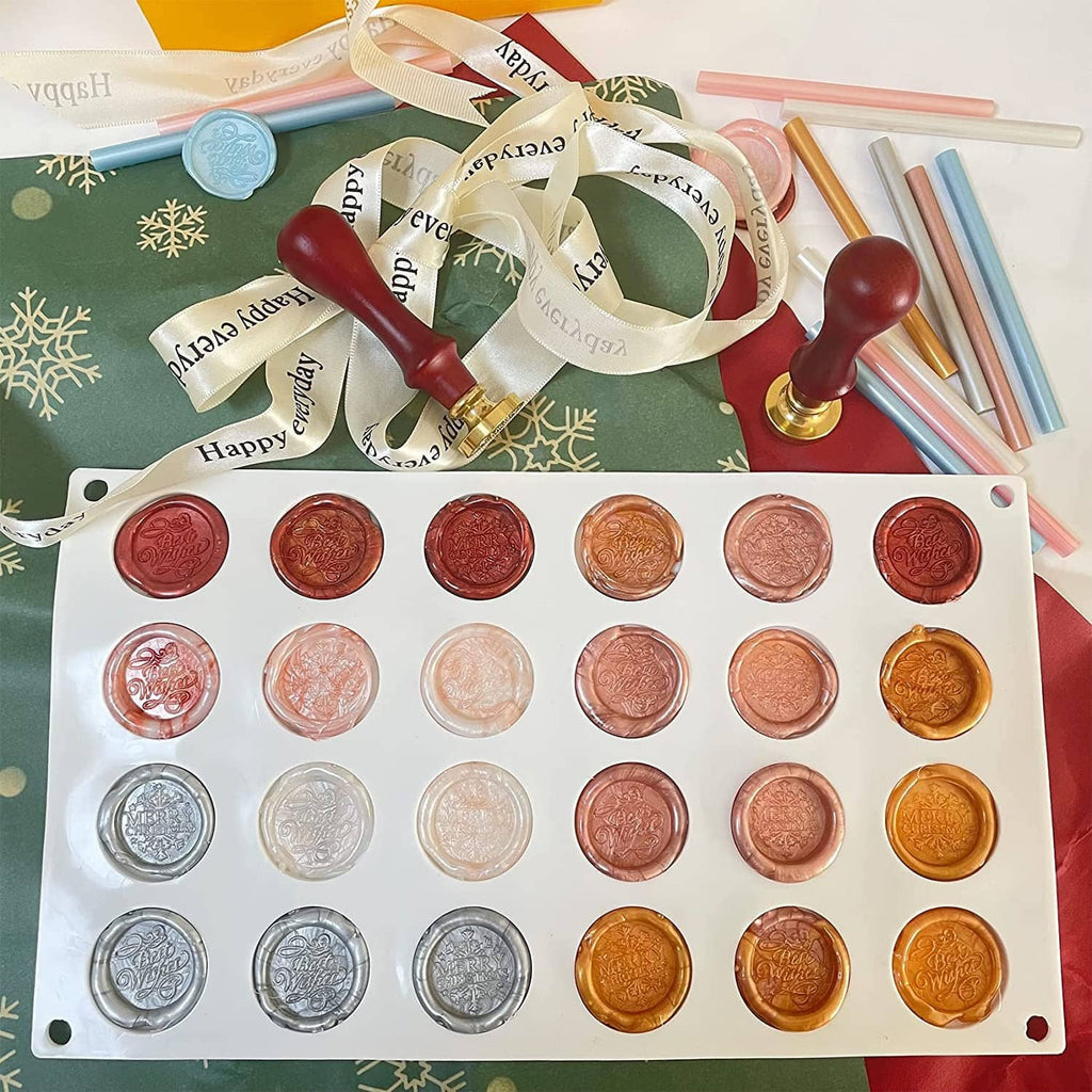 Silicone wax seal mat with 24 cavities showing gold, red, copper and silver wax seal discs