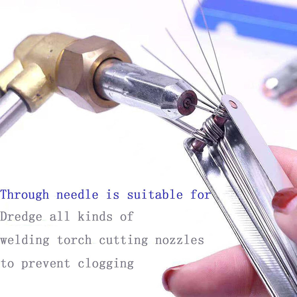 Torch nozzle cleaning tool with extending stainless steel needles in a metal holder