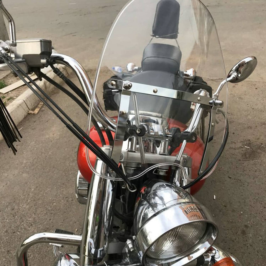 Clear detachable motorcycle windshield with black mounting bracket and hardware.