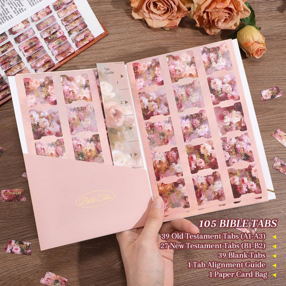Rose-pink Bible tab sleeves with gold-foil floral index sheets and tab labels.
