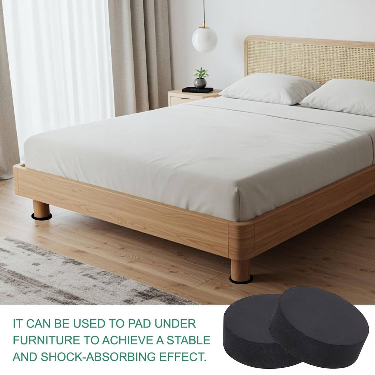 Black round non-slip furniture pads under wooden bed legs, plus spare discs