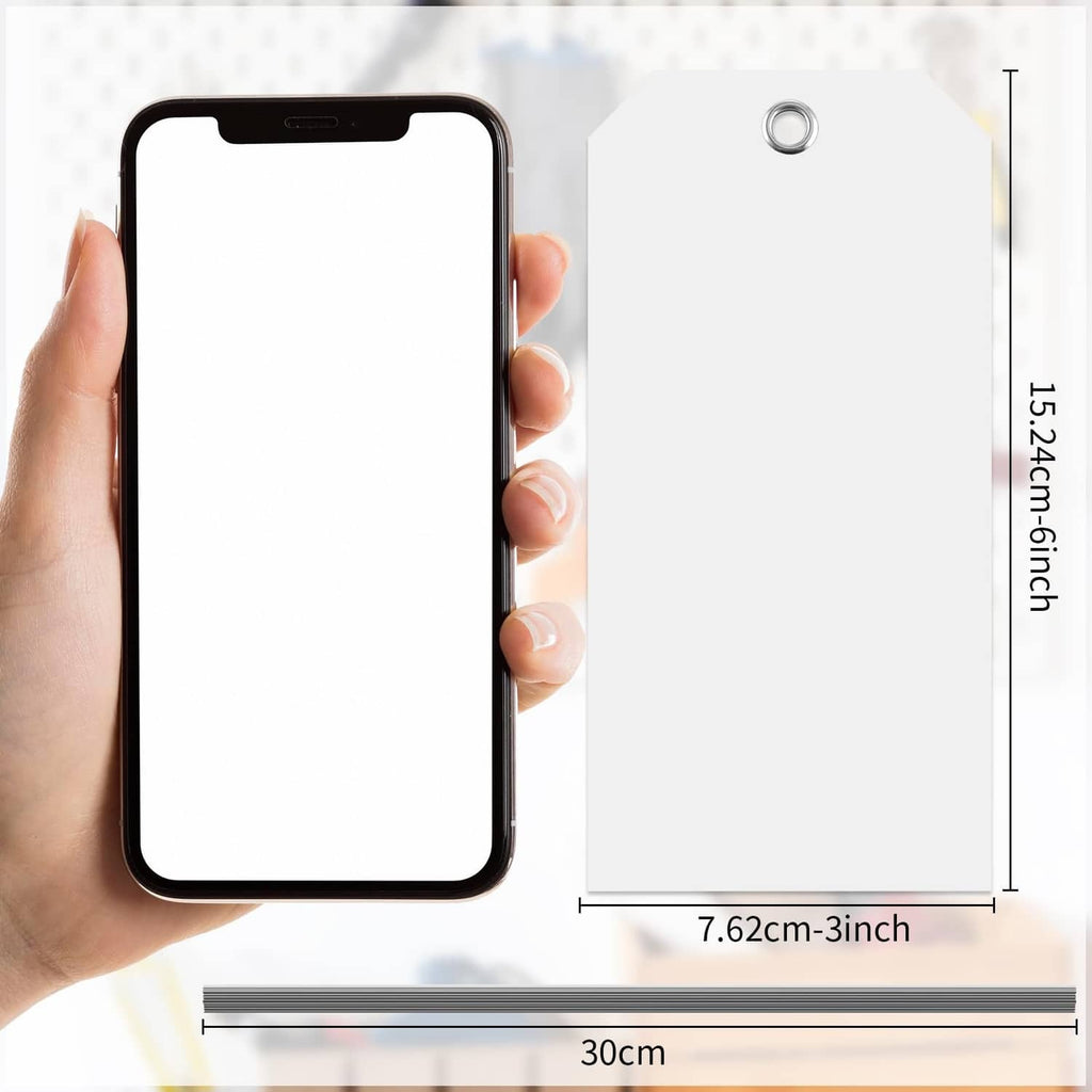 White 3x6 inch shipping tag with single hole, shown beside hand for size