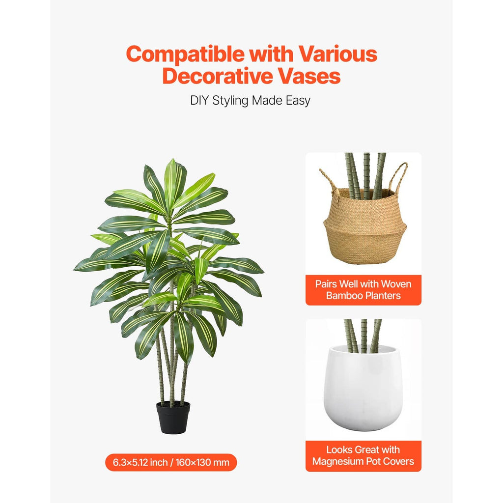 Faux dracaena tree with green leaves in a white pot, tabletop display