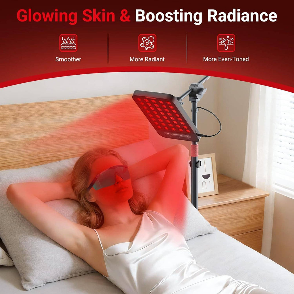 Red light therapy lamp beside bed with glowing red LED panel